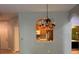 Open-concept dining area with chandelier and archway to the kitchen at 8775 Sartori St # 307, Orlando, FL 32829