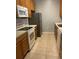 Well-equipped kitchen with appliances, countertops, and plenty of storage at 8775 Sartori St # 307, Orlando, FL 32829