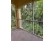 Screened lanai for enjoying the outdoors and beautiful views of the surrounding greenery at 8775 Sartori St # 307, Orlando, FL 32829