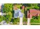 Aerial view of the property showcasing a fenced backyard, shed, and mature trees at 879 Matt Ln, Port Orange, FL 32127