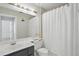 Bathroom featuring neutral colors with a shower, vanity, and soft lighting at 879 Matt Ln, Port Orange, FL 32127