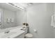 Neutral-toned bathroom featuring a spacious mirror, vanity, and toilet at 879 Matt Ln, Port Orange, FL 32127