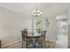 Charming dining area featuring a decorative chandelier and a cozy table set for a pleasant meal at 879 Matt Ln, Port Orange, FL 32127