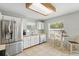 Bright kitchen with stainless steel appliances, tile flooring, and a cozy breakfast nook at 879 Matt Ln, Port Orange, FL 32127