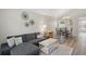 Cozy living room with wood floors, stylish decor, and dining area perfect for Gathering gatherings at 879 Matt Ln, Port Orange, FL 32127