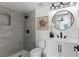 This bathroom boasts a modern gray tiled shower and updated fixtures at 9987 Triple Crown Cir, Orlando, FL 32825