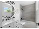 Updated bathroom with a tiled shower, sleek vanity, and modern fixtures at 9987 Triple Crown Cir, Orlando, FL 32825