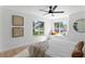 Bright bedroom boasts sunlit window seats and stylish interior design at 9987 Triple Crown Cir, Orlando, FL 32825