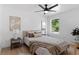 Well-lit bedroom offers side tables, lamps, and a comfortable bed at 9987 Triple Crown Cir, Orlando, FL 32825