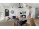 Bright living room featuring white walls, a ceiling fan, modern furnishings, and light wood flooring at 9987 Triple Crown Cir, Orlando, FL 32825