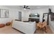 Spacious living area with a comfortable sofa, decorative accents, and a modern entertainment setup at 9987 Triple Crown Cir, Orlando, FL 32825