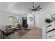 Inviting living room with comfortable seating, large windows, and modern decor accents at 9987 Triple Crown Cir, Orlando, FL 32825