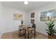 Cozy office features a practical desk, a comfortable chair, and natural light at 9987 Triple Crown Cir, Orlando, FL 32825