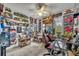 Bright, carpeted bedroom creatively decorated with collectibles and a ceiling fan at 3715 S Lake Orlando Pkwy # 11, Orlando, FL 32808