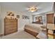 Cozy bedroom with a comfortable bed, soft carpet, and a ceiling fan at 3715 S Lake Orlando Pkwy # 11, Orlando, FL 32808
