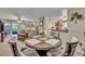 Open-concept dining area with seating for four, seamlessly connected to the living room and kitchen at 3715 S Lake Orlando Pkwy # 11, Orlando, FL 32808