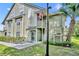 Inviting two-story home featuring classic siding, an American flag, and a well-maintained lawn at 3715 S Lake Orlando Pkwy # 11, Orlando, FL 32808