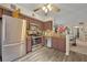 Well-lit kitchen with stainless steel appliances, brown cabinets, and stylish backsplash at 3715 S Lake Orlando Pkwy # 11, Orlando, FL 32808