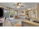 Comfortable living room with neutral-toned furniture, balcony access, and modern decor at 3715 S Lake Orlando Pkwy # 11, Orlando, FL 32808