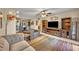Inviting living space with stylish seating, mounted TV, and open access to the dining area at 3715 S Lake Orlando Pkwy # 11, Orlando, FL 32808