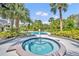 Community pool and hot tub surrounded by tropical landscaping and palm trees on a sunny day at 3715 S Lake Orlando Pkwy # 11, Orlando, FL 32808