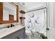 Modern bathroom with vanity, decorative mirror and an elegant shower curtain at 1012 Marisol Ct, Orlando, FL 32828