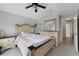 Spacious bedroom with ceiling fan, large bed, dresser, and neutral decor at 1012 Marisol Ct, Orlando, FL 32828