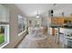 Bright breakfast nook with a round table and large windows at 1012 Marisol Ct, Orlando, FL 32828