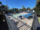 The community pool with lounge chairs and a splash pad is a relaxing area for residents at 1012 Marisol Ct, Orlando, FL 32828