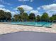 A spacious community swimming pool with plenty of lounge chairs for residents at 1012 Marisol Ct, Orlando, FL 32828