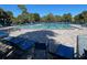 A spacious community pool with plenty of lounge chairs and palm trees at 1012 Marisol Ct, Orlando, FL 32828