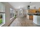 Bright dining area with a view of the backyard, featuring tile flooring and plenty of natural light at 1012 Marisol Ct, Orlando, FL 32828