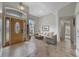 Inviting foyer with a decorative front door and tile flooring leading to the living area at 1012 Marisol Ct, Orlando, FL 32828