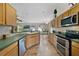 Spacious kitchen featuring modern appliances and views of the living area at 1012 Marisol Ct, Orlando, FL 32828