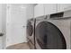 Laundry room with modern washer and dryer at 1012 Marisol Ct, Orlando, FL 32828