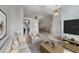 Open-concept living room with neutral paint, plush furniture, and view to the dining area at 1012 Marisol Ct, Orlando, FL 32828
