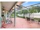 Screened-in patio with seating, providing an ideal outdoor living space at 1012 Marisol Ct, Orlando, FL 32828