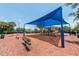 Community playground with covered play structures, swings, and a soft mulch ground at 1012 Marisol Ct, Orlando, FL 32828