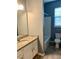 Well-lit bathroom features granite vanity top and a shower-tub combo at 10126 Beach Port Dr, Winter Garden, FL 34787