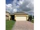 Charming single-story home with a two-car garage and a brick-paved driveway at 10126 Beach Port Dr, Winter Garden, FL 34787