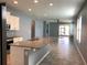 Open-concept kitchen with granite counters, stainless appliances, and a spacious island at 10126 Beach Port Dr, Winter Garden, FL 34787