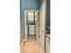 Convenient laundry room adjacent to the kitchen with modern washer and dryer at 10126 Beach Port Dr, Winter Garden, FL 34787