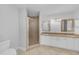 Bathroom with double sinks, granite countertops, and tiled stand up shower at 1013 Inlet Way, Altamonte Springs, FL 32714
