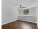 A clean empty room with hard wood floors and a window at 1013 Inlet Way, Altamonte Springs, FL 32714