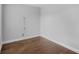 Empty bedroom with hardwood floors, an electrical outlet and neutral-colored walls at 1013 Inlet Way, Altamonte Springs, FL 32714