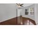 Bright bedroom with hardwood floors, a ceiling fan, and ample closet space at 1013 Inlet Way, Altamonte Springs, FL 32714