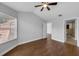 Spacious bedroom with wood floors, a ceiling fan, and an en-suite bathroom at 1013 Inlet Way, Altamonte Springs, FL 32714