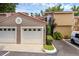 Attached two-car garage with tile roof, landscaping and parking spaces at this home at 1013 Inlet Way, Altamonte Springs, FL 32714