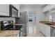 Bright kitchen features granite countertops, stainless steel appliances, and tile flooring at 1013 Inlet Way, Altamonte Springs, FL 32714