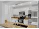 A kitchen with granite countertops, stainless steel appliances, and white cabinets at 1013 Inlet Way, Altamonte Springs, FL 32714